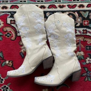 White cowboy boots with rhinestone embellishments